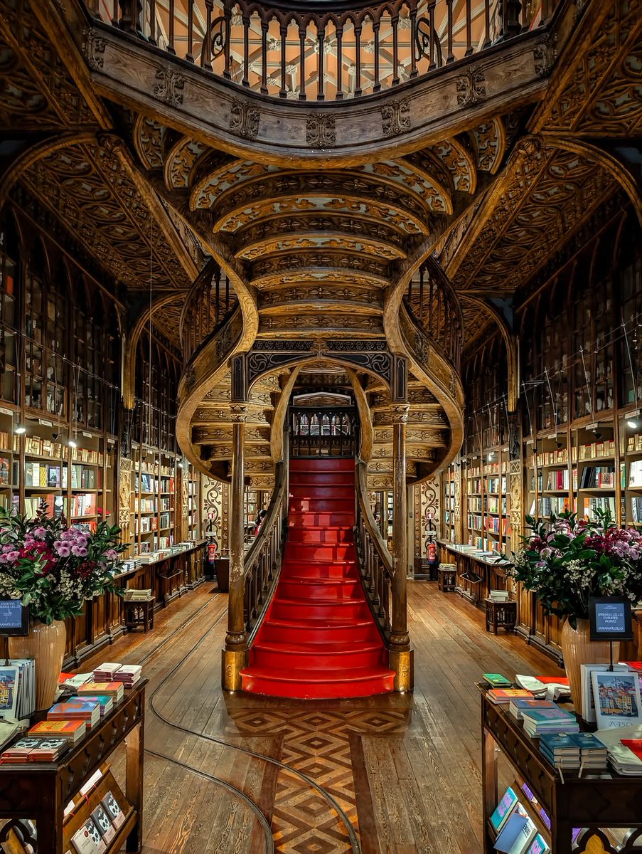 The stunning interior of Livraria Lello (Lello Bookstore) in Porto, Portugal. One of the most beautiful bookstores in the world, it is renowned for its Neo-Gothic and Art Nouveau architecture.