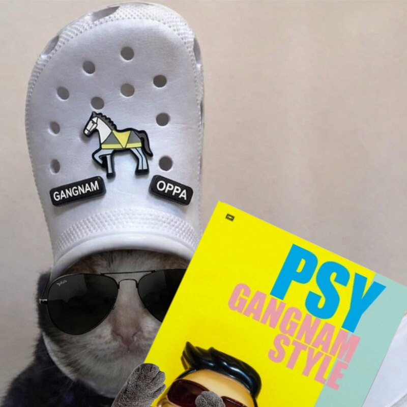 wlodkow's tweet photo. Gangnam Style was the first YouTube video to hit 1B views (Dec 21, 2012). 

That milestone measures distribution of a single object. A meme measures something else: when the object collapses into a template.

Gesture / dance / attitude → a low-friction format people can reproduce.

It didn’t “last” because it was the biggest - it lasted because it was copyable.

That’s the gap between popularity and a cultural mechanism.

Question: is memetic reproduction structurally depoliticizing - a machine that turns satire into a neutral, reusable template?