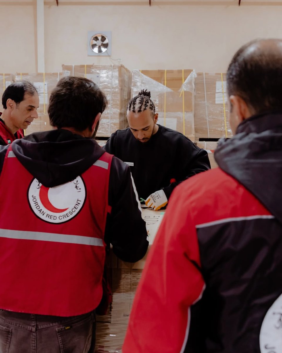 Muslim's tweet image. F1 champion Lewis Hamilton packs aid kits for Palestinians in Gaza during visit in Jordan. 🥹