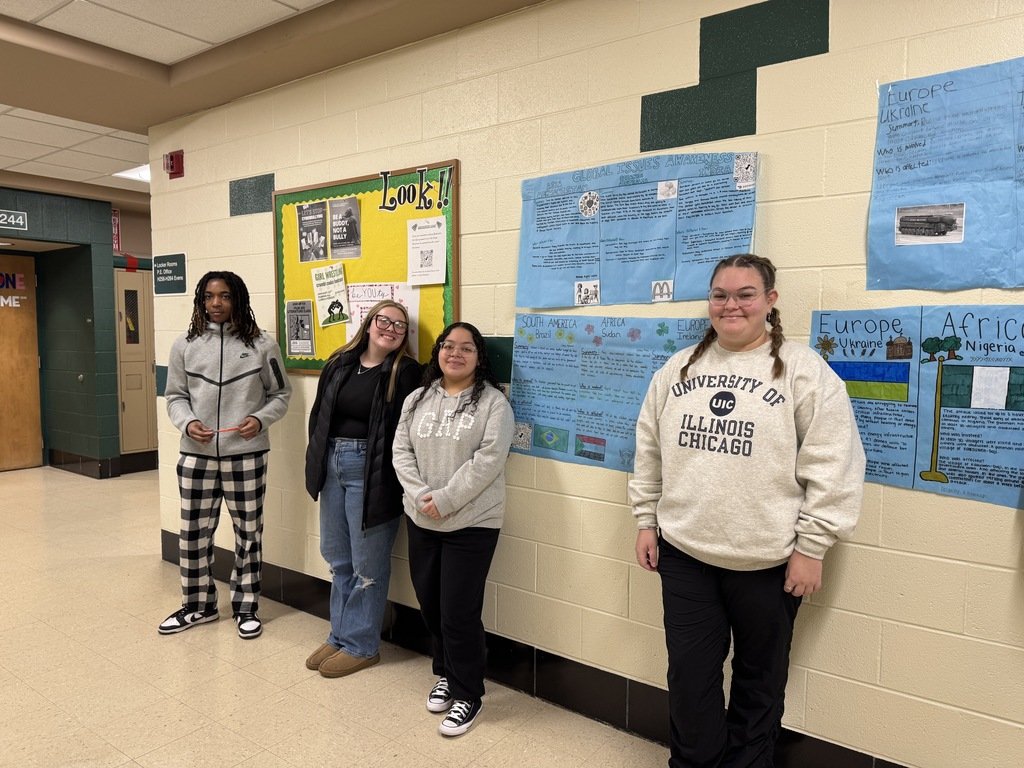 PHSCCADMIN's tweet image. Here are some of our English 4 students participating in a Wall Walk, where they analyze posters they created about different countries. As they move around the room, students collect information that will support an upcoming editorial essay focused on global social issues.