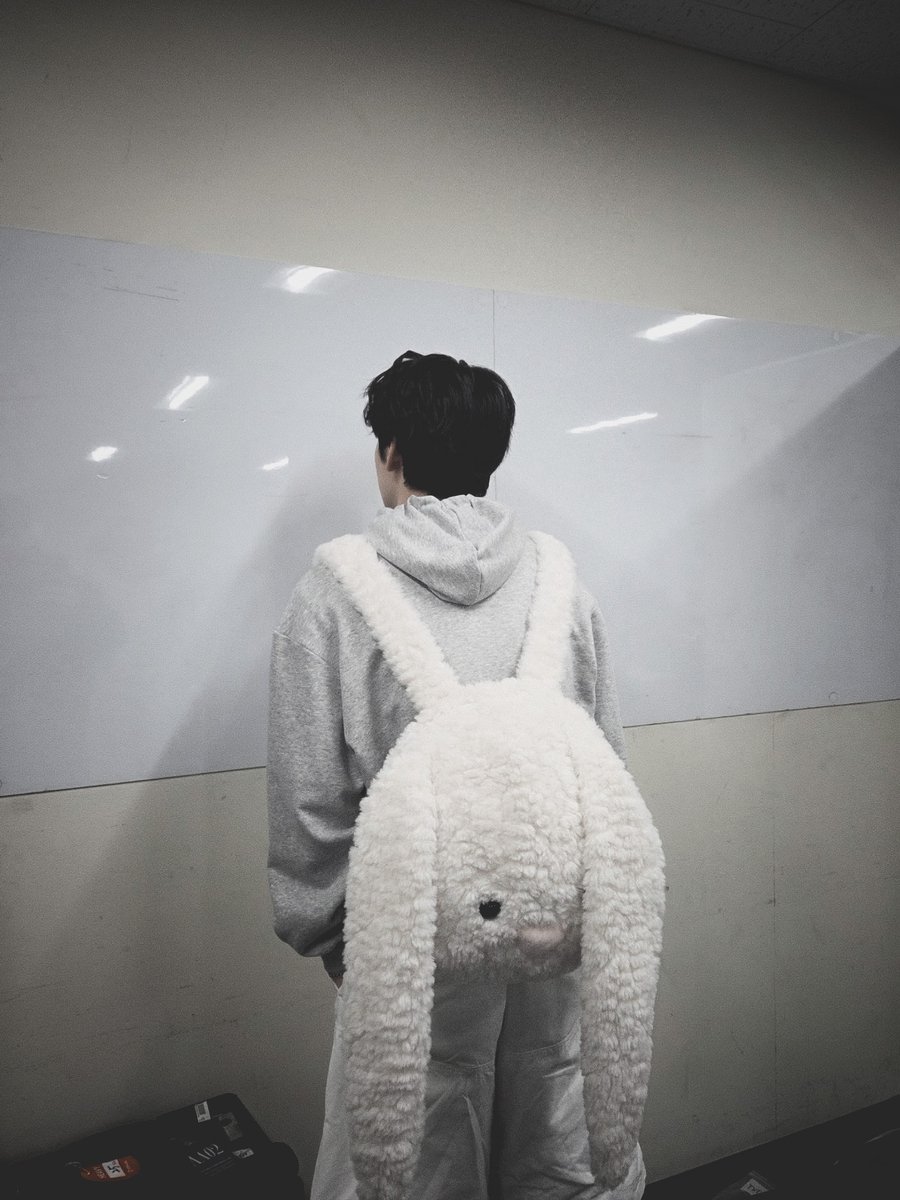 SOOUBINA's tweet image. Some days feel lighter when you carry a little softness with you. A quiet hallway, a hoodie pulled close, and something playful on your back small comforts that make ordinary moments feel a bit warmer.