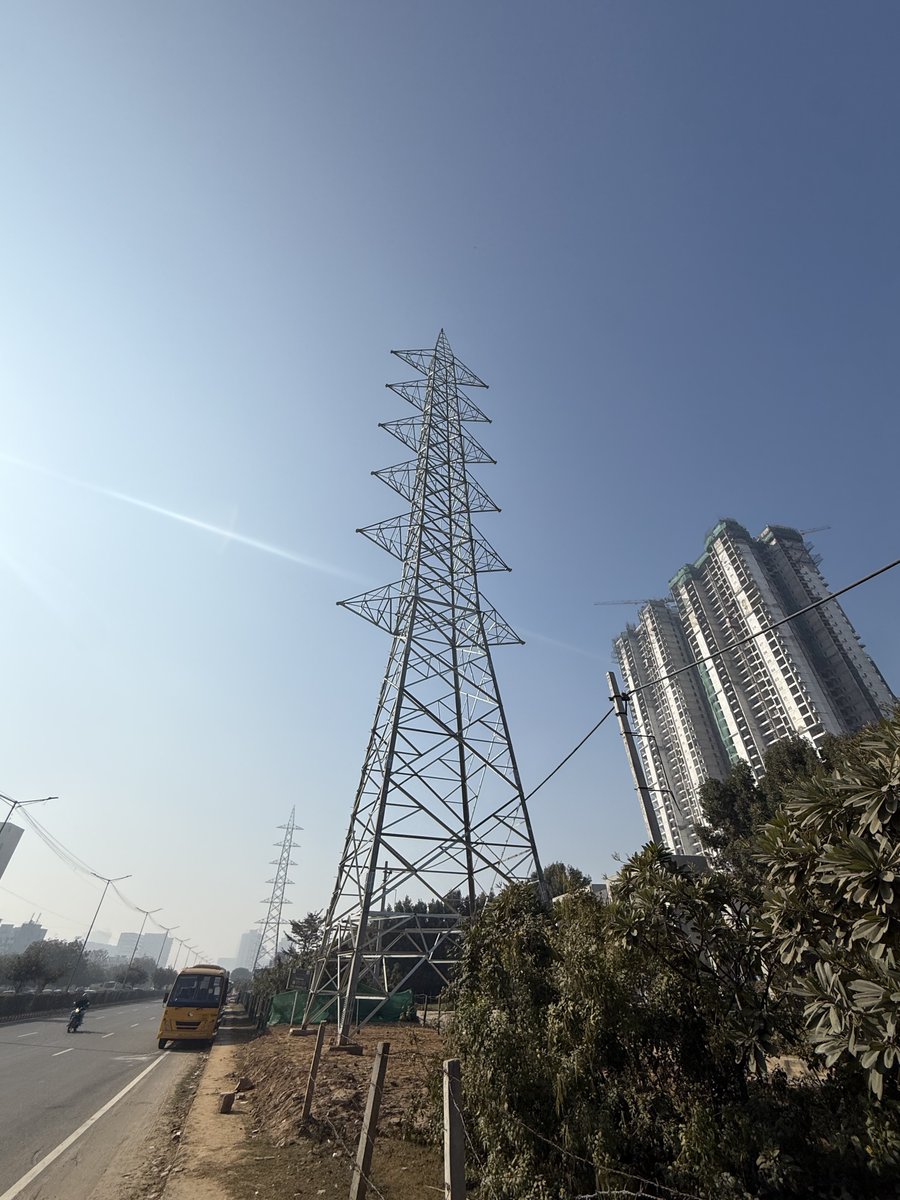 Overhead High Tension wires were meant to go underground. Instead our authorities are planting more of them. Yeh banayenge Gurgaon ko Dubai. Outside Puri Aravallis, Medawas Road.