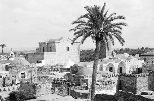 1900s, Lodd, Palestine 🇵🇸 

A rooftop view of the ancient city of, with the Church of St. George prominent in the background.