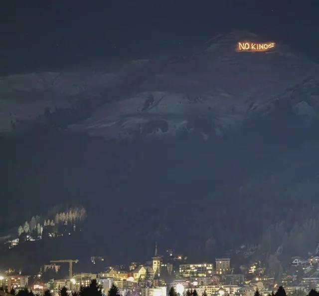 A group of ten local residents climbed 800 meters above the city and lit 450 torches to form the message: "No Kings." This is how Davos welcomed Trump.