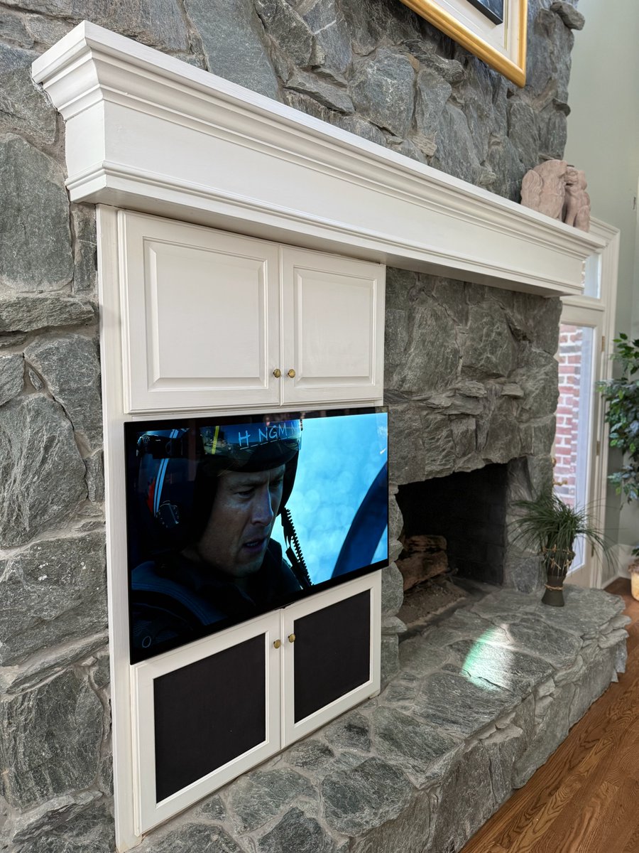 This is not your typical tv placement but on a cold day, being close to the fire just makes sense.  🔥
