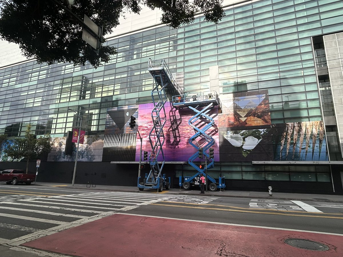 JConrBOrtega's tweet photo. The Mayor @DanielLurie says San Francisco is on the rise. Nothing says on the rise than hiding an empty mall with colourful wallpaper so no one can see the carcass of what used to be. https://t.co/qdfDliHnsR