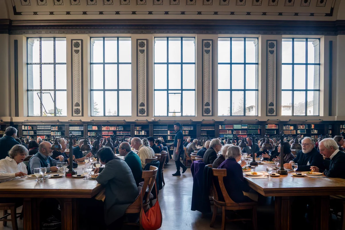 Guests dine in Doe Library’s North Reading Room during the Luncheon in the Library.
