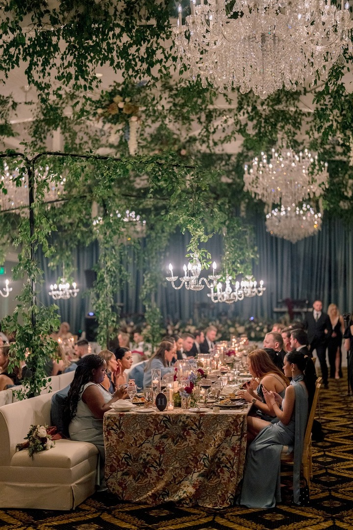 When your 'something blue' is show-stopping drapery that sets the scene for every memory at your reception. Taylor + Nick's wedding reception proves that the right backdrop elevates everything! (Wyeth Augustine Photography) #WeddingDrapery #WeddingWednesday