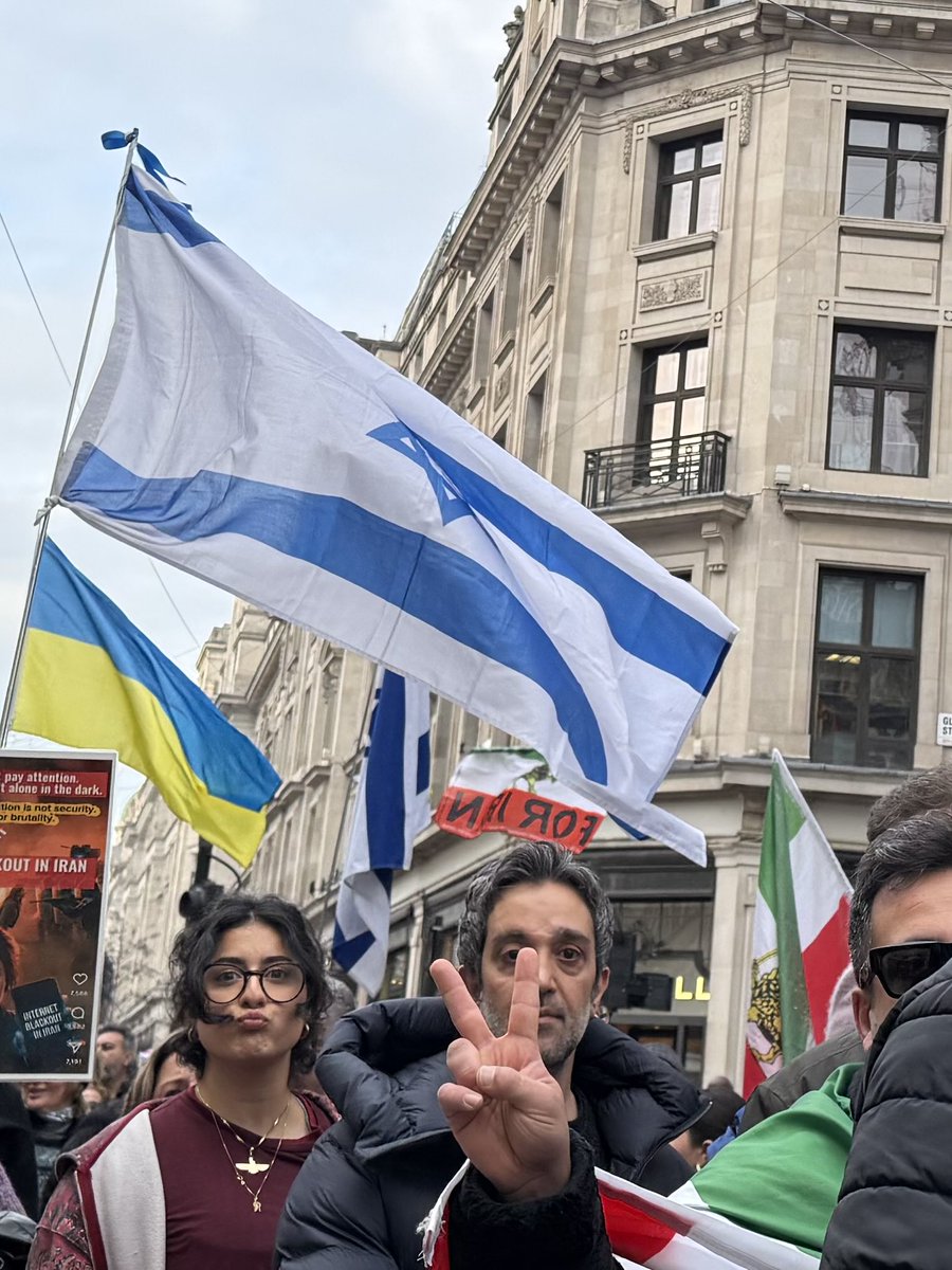 MaxBlumenthal's tweet image. Flags of the genocidal Israeli regime are almost as prominent at daily London rallies for “freedom” in Iran as the monarchist flag

Is it any wonder the world fails to find inspiration in this pro-war movement?