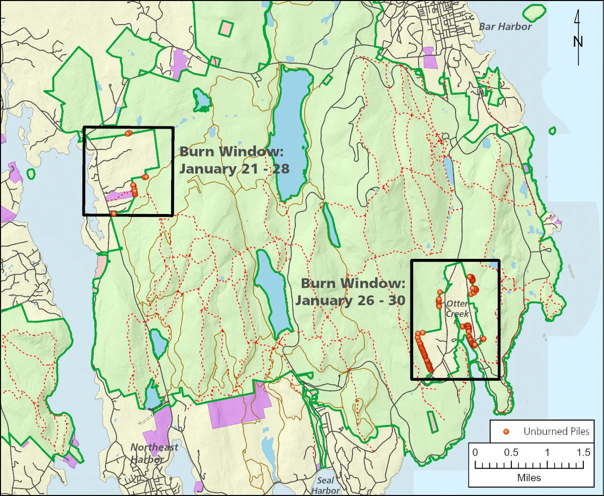 Map showing two burn windows in a forested area near Bar Harbor with marked unburned piles and trails.