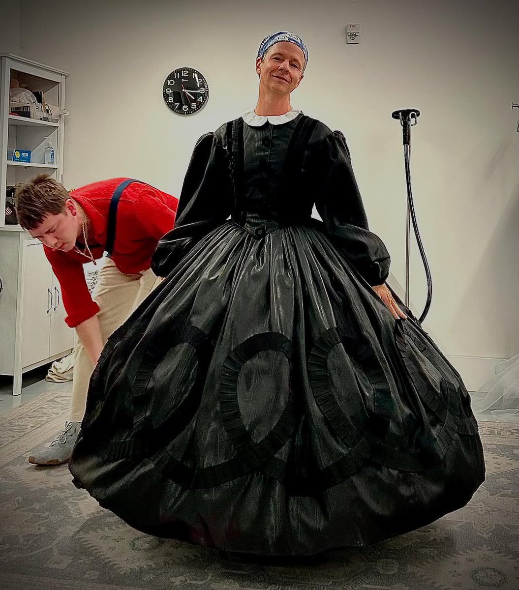 Dress fitting, but the wig is still in a box.