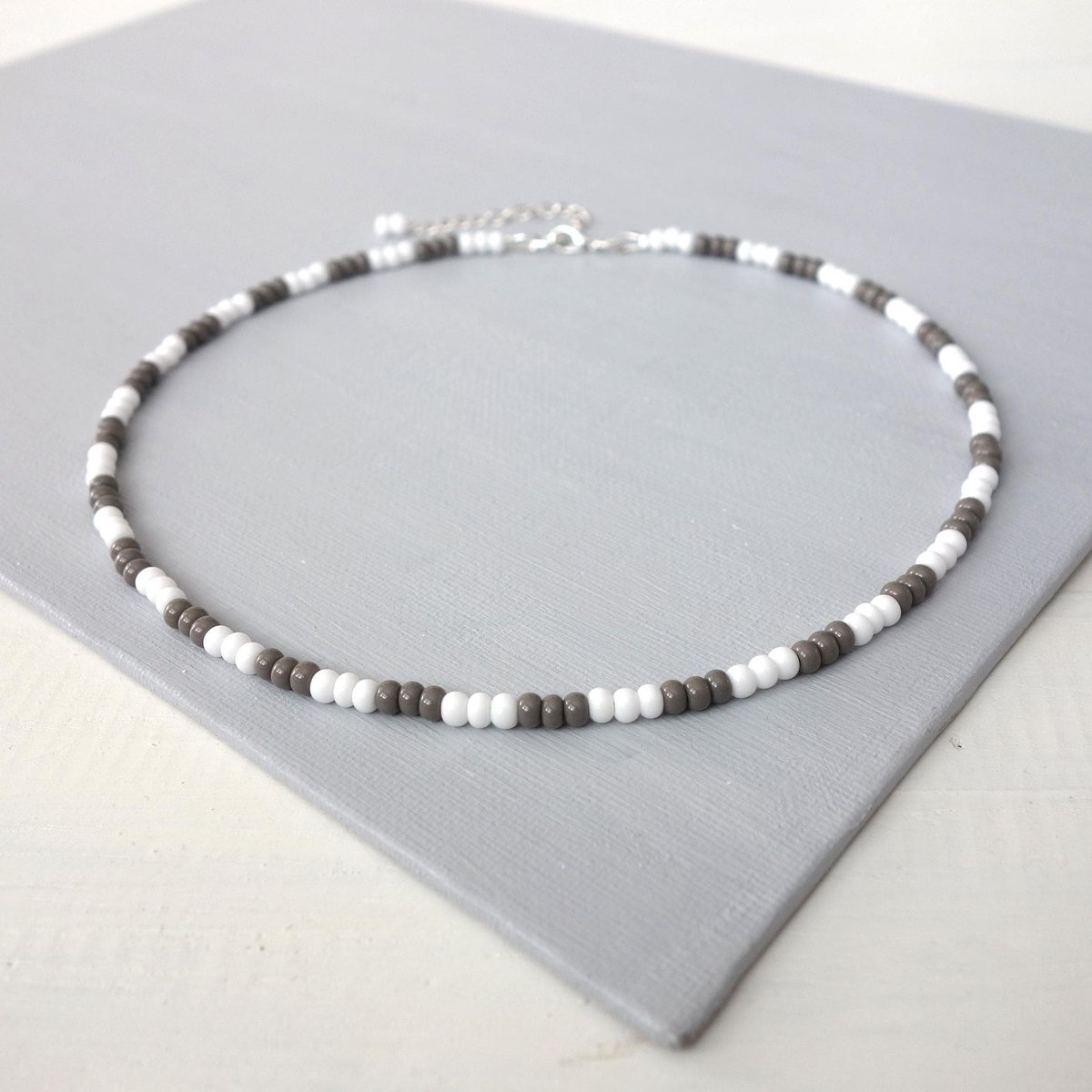 tlineSE's tweet photo. Unisex Beaded Choker White Gray Seed Beads Minimalist Necklace. #coolstyle #jewelry #etsy #giftideas #shopsmall #etsyshop https://t.co/jEraeN7W0t via @Etsy https://t.co/YRMQjo9nYq