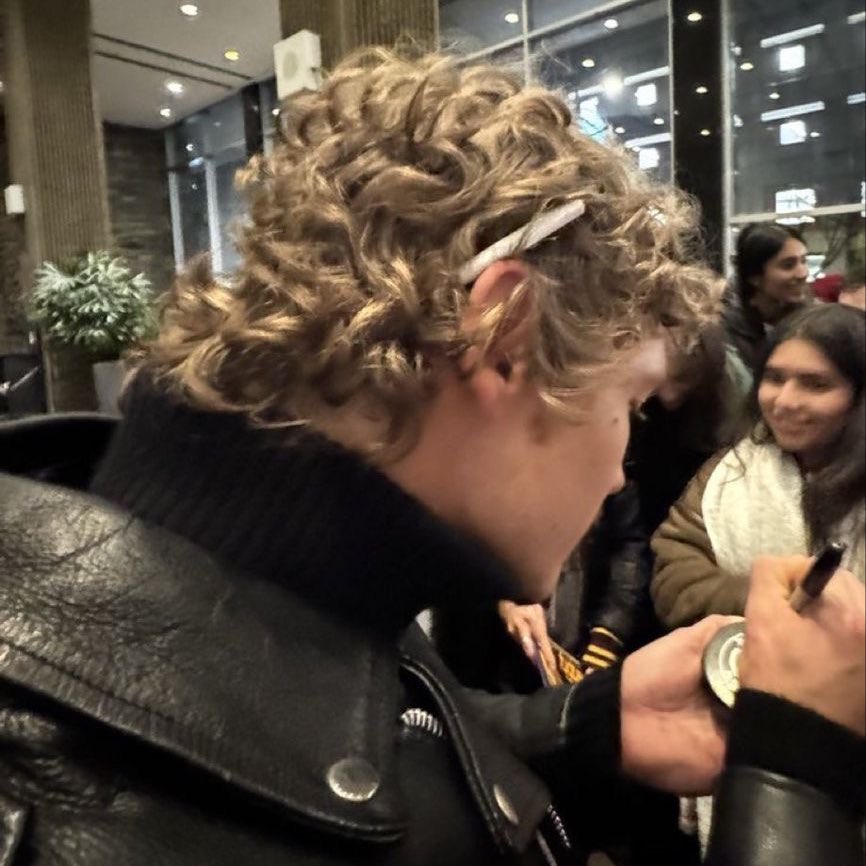 rozroan's tweet image. Genre: Connor Storrie looking hot as fuck while smoking and in this outfit.