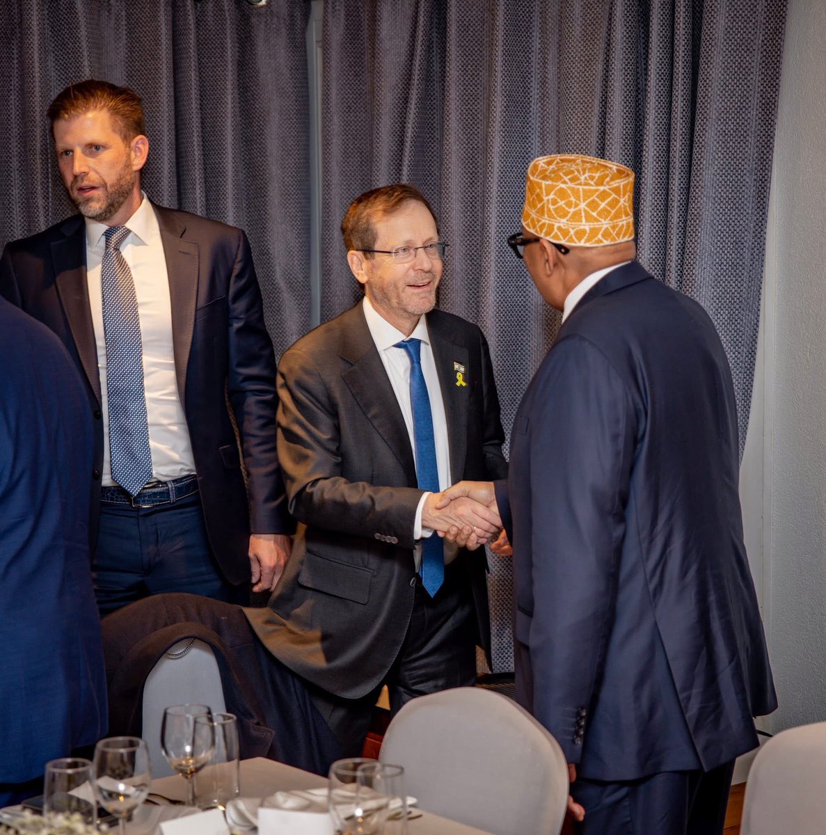 cadaad10's tweet photo. A historic and commendable moment at #Davos: The President of Somaliland engaging with the President of Israel and Eric Trump—an important step in strengthening Somaliland’s global visibility and international engagement. https://t.co/ce1NuhvK9p