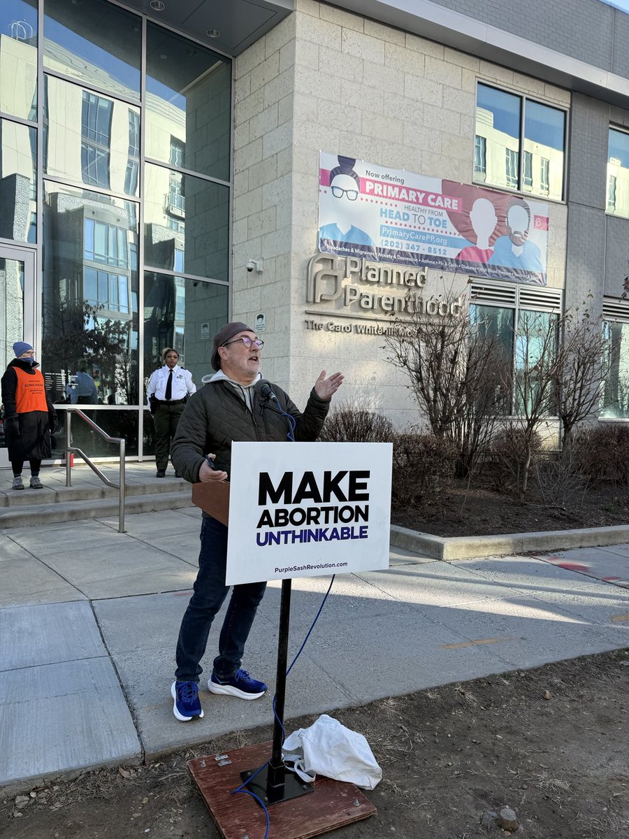 revmahoney's tweet photo. Outside the Planned Parenthood mega abortion center in Washington DC on the Roe v Wade Memorial. Celebrating the fact that nearly 70 Planned Parenthood’s closed in 2025! Praying this one closes soon! #MakeAbortionUnthinkable #ReplacePlannedParenthood @mercedesschlapp https://t.co/nQKtIgDKst
