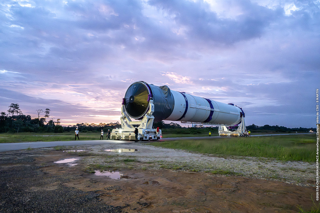 ArianeGroup's tweet photo. 🚀 Ariane 64 campaign milestone: central core transferred to the launch pad

The central core of Ariane 64, composed of the main stage and upper stage, fully assembled, has been transferred from the integration building to the launch pad at Europe’s Spaceport in French Guiana.

This operation marks a new step in the launch campaign, as the launcher is now positioned vertically on the launch pad, ready for the next phases of integration.

This first Ariane 64 embodies years of development, qualification and industrial ramp-up. It demonstrates ArianeGroup’s ability to deliver a powerful, modular and reliable launcher, designed to meet the most demanding missions.

With the central core now standing, teams will move forward with:
- The integration of the four P120C boosters,
- Transfer of the long fairing to the launch zone, and installation on the launcher,
- Launch readiness review,
- Final launch Countdown and liftoff.

At ArianeGroup, every milestone reflects the collective expertise of our teams, engineers, technicians and partners, working together to turn a new generation of launcher into operational reality.

The first Ariane 64 is now standing.
A new chapter for European launch capability is taking shape.

@Arianespace @esa @CNES  @EuropeSpacePort @Amazonleo

#RocketMakers #Ariane6