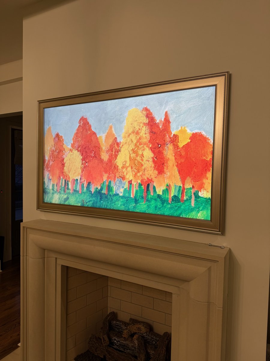 Seeing how a custom frame and artwork make a TV blend into a space never gets old.