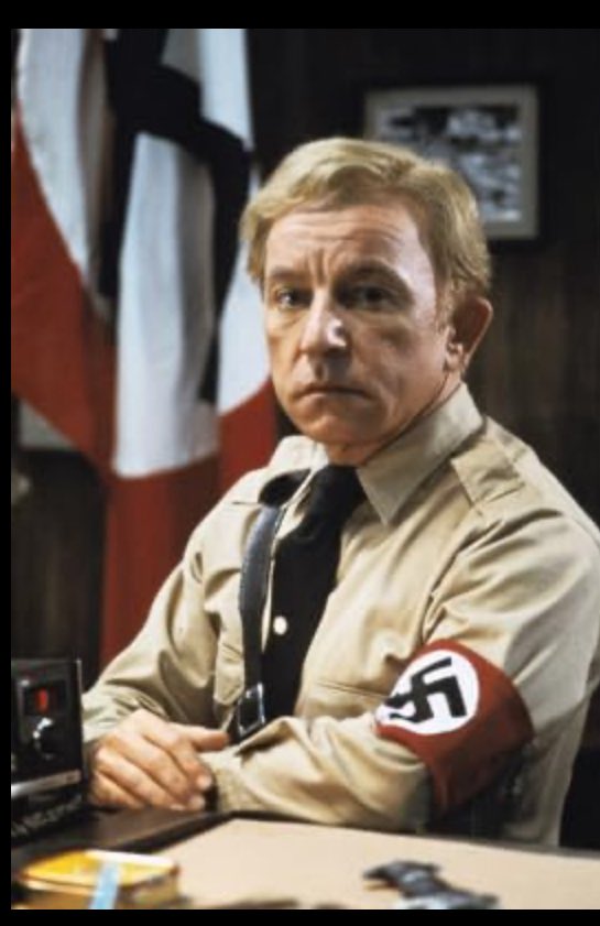 This is Chief Patrol Agent Gregory Bovino who’s ICE agents snatch a 5 year old boy from a car to lure his father out of his house, they are now in Texas, 1000 miles away from home. The other is a nice actor called Henry Gibson still from Blues Brothers. Bovino in wrong uniform ?