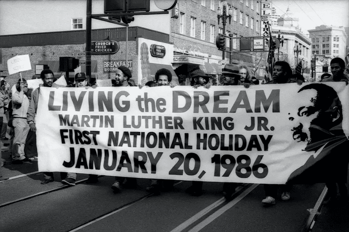 TammiMinoski's tweet image. On January 20, 1986, the United States celebrated its first national Martin Luther King Jr. holiday. It was three years after the holiday was signed into law and 18 years after the fight for a King holiday began. nmaahc.si.edu/explore/storie… #USHistory #MLKDay