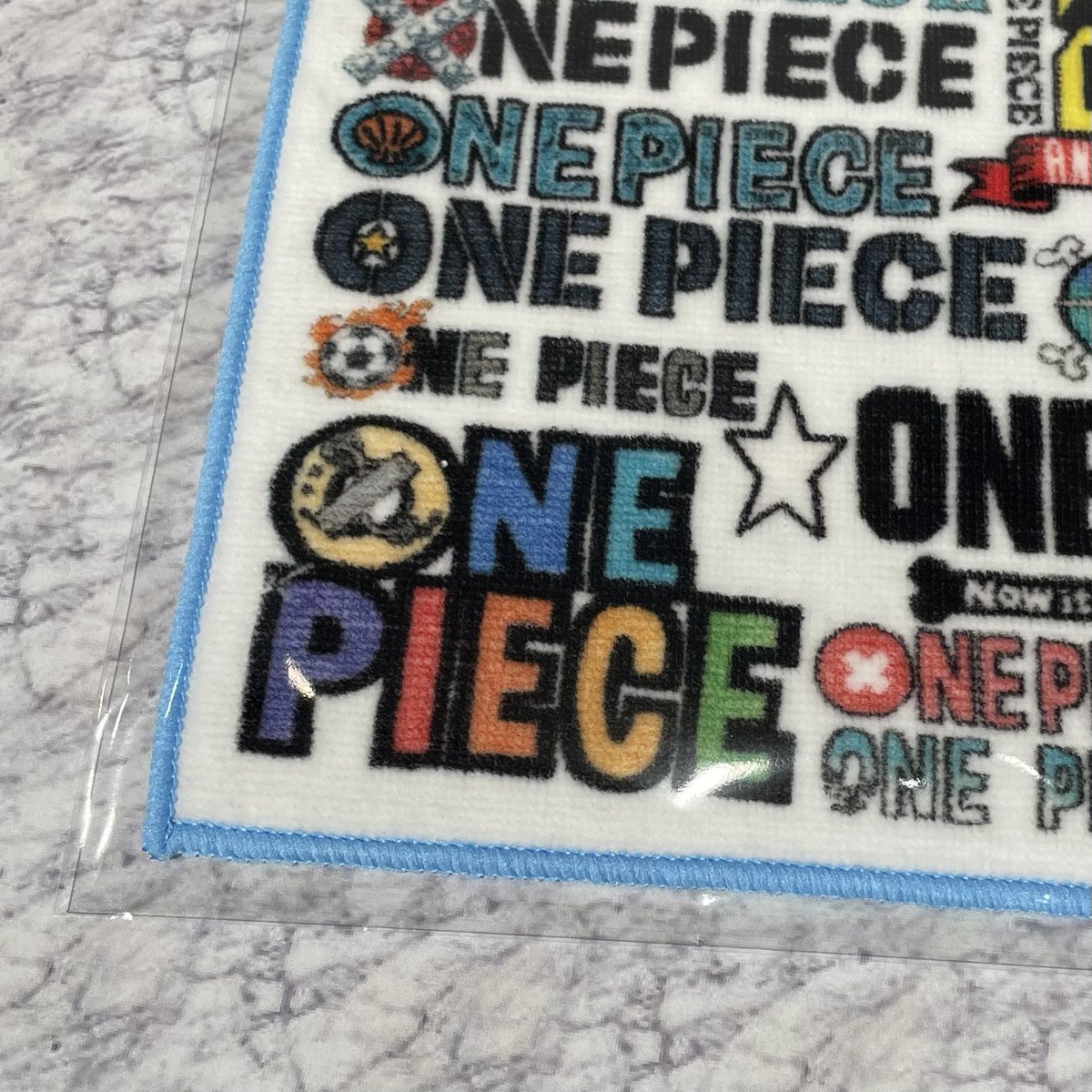 再入荷】原画商品 連載20周年記念 ロゴがいっぱいハンドタオル 770円