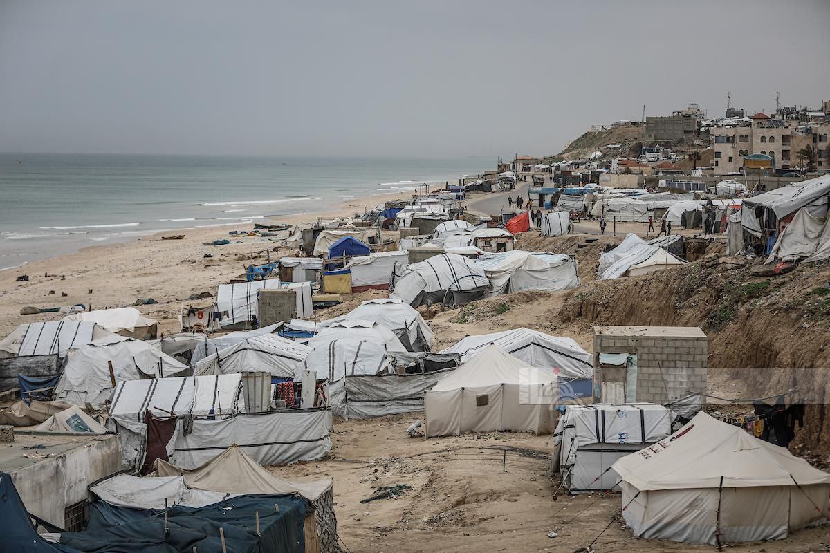 WAFANewsEnglish's tweet image. Displaced families inspect their tents after they were damaged by a powerful windstorm that struck a displacement camp in central Gaza, adding to the hardships facing those displaced by the Israeli aggression.