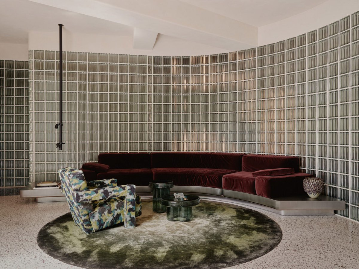 dezeen's tweet image. Steel-panelled fireplace forms heart of Emiel Vercruysse's renovated 1950s townhouse: dezeen.com/2026/01/23/ber…