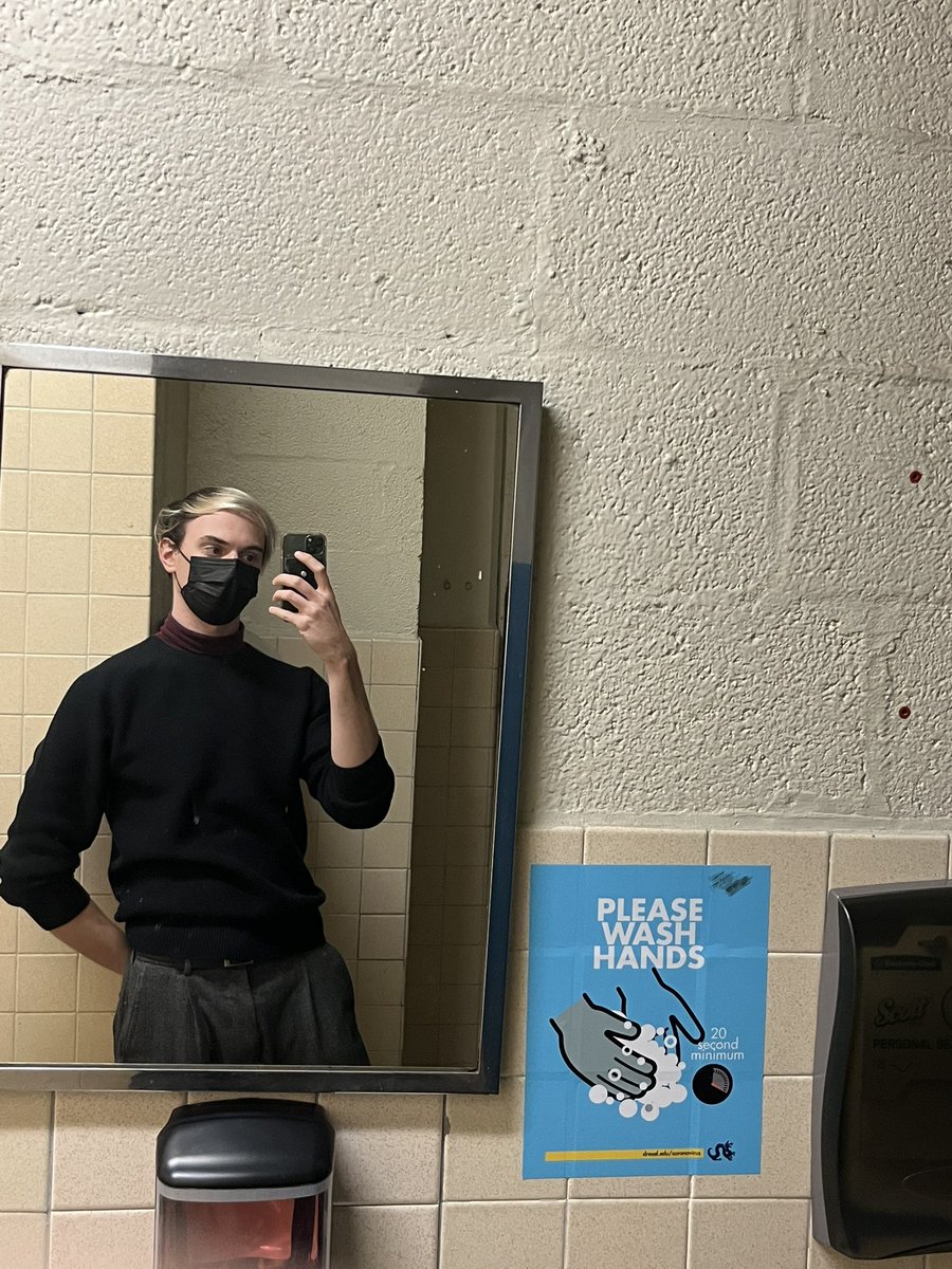 Rocking the illness mask in the bathroom with the leaky sink and the ominous, omnipresent thrumming sound
