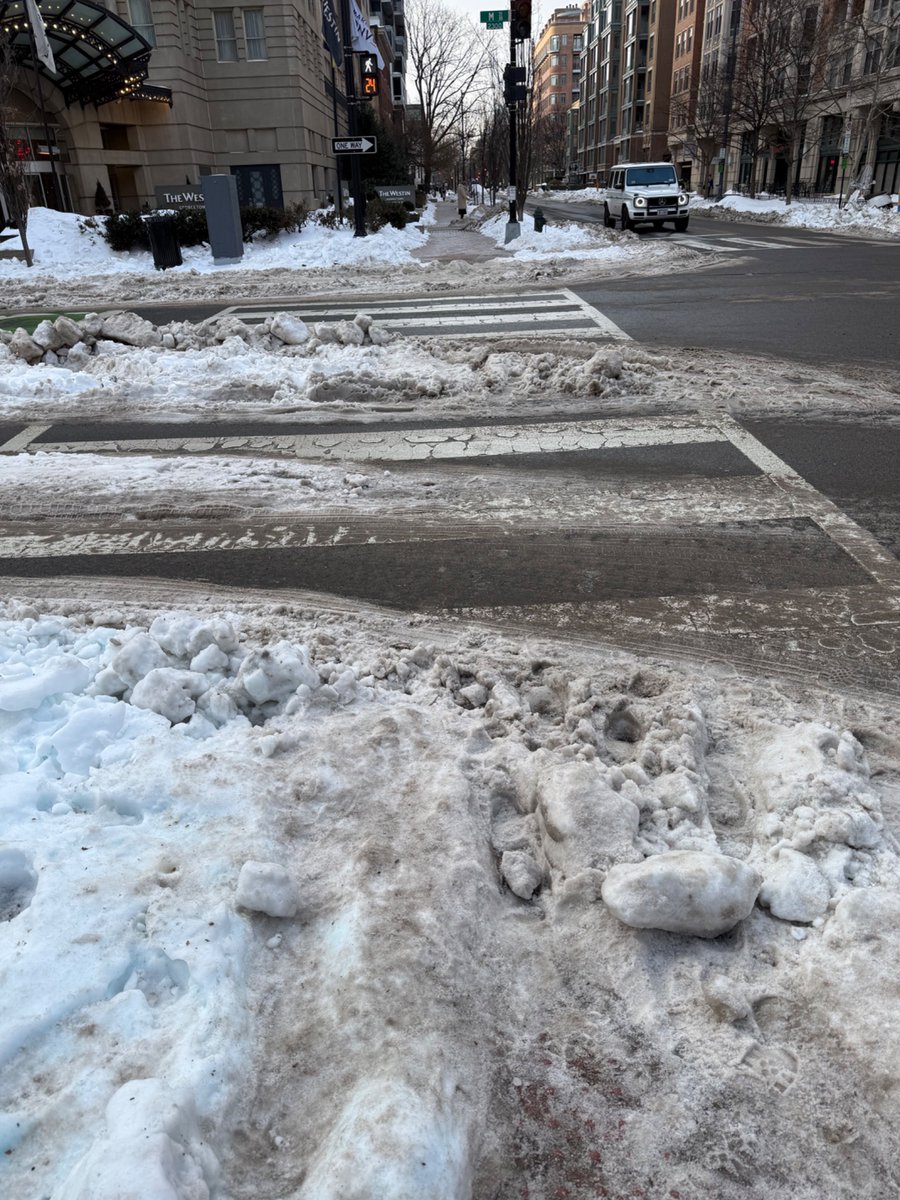 The still very icy crosswalk at M and 24th NW an entire WEEK after it snowed. <a href="/MayorBowser/">Mayor Muriel Bowser</a>