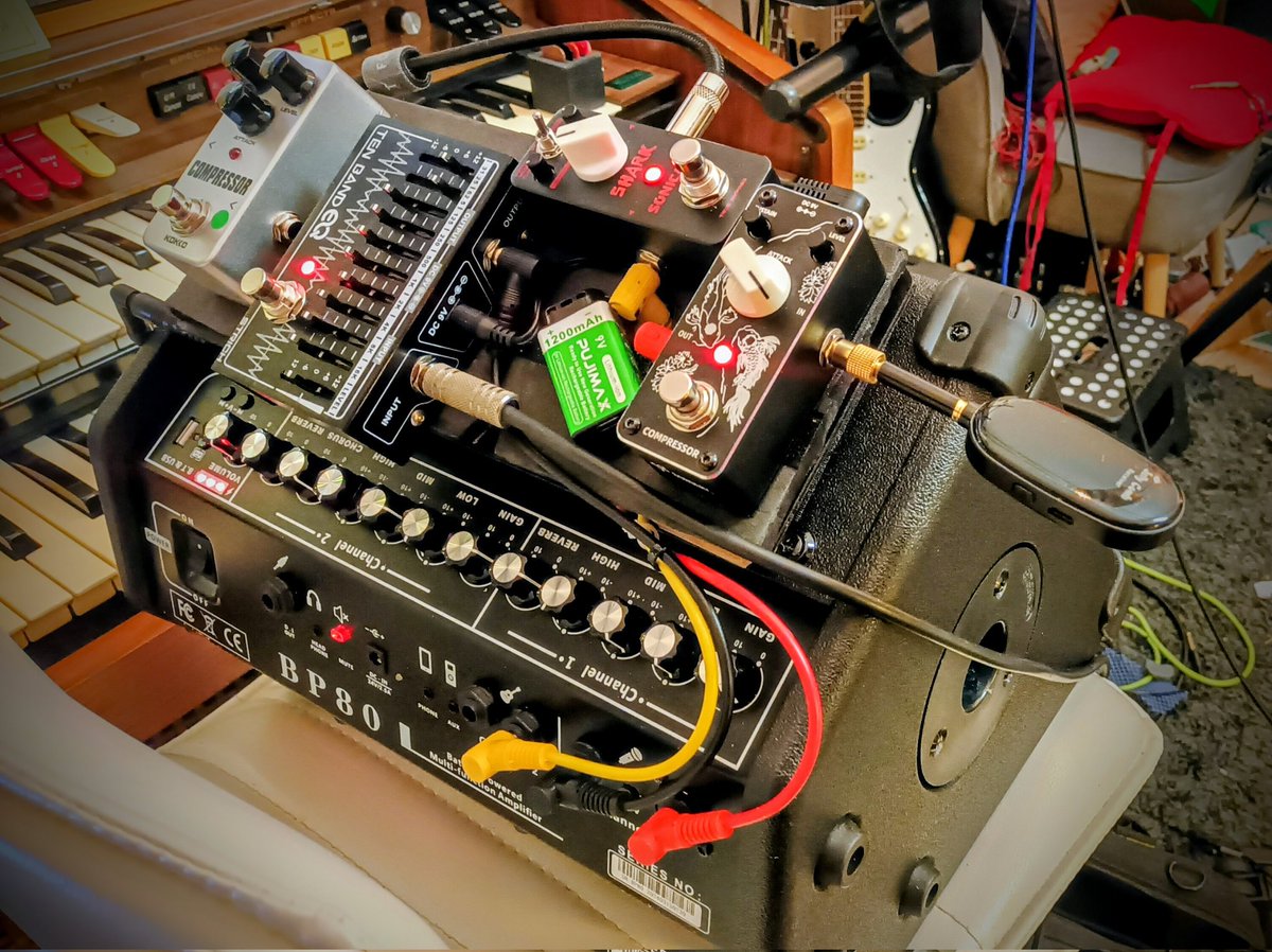 Rig evolution. No fuss Battery version : 
 comp for vocal, a distortion for the Reso Guitar, EQ for the stompenator. Amp verb to taste.
As we proceed, the path ahead is illuminated.. march on!