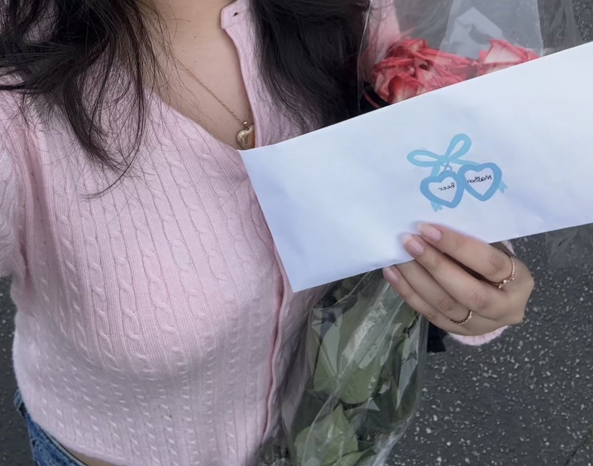 mads taking the time to read &amp; go through each gift. oh my heart. 
mines somewhere in there :’)