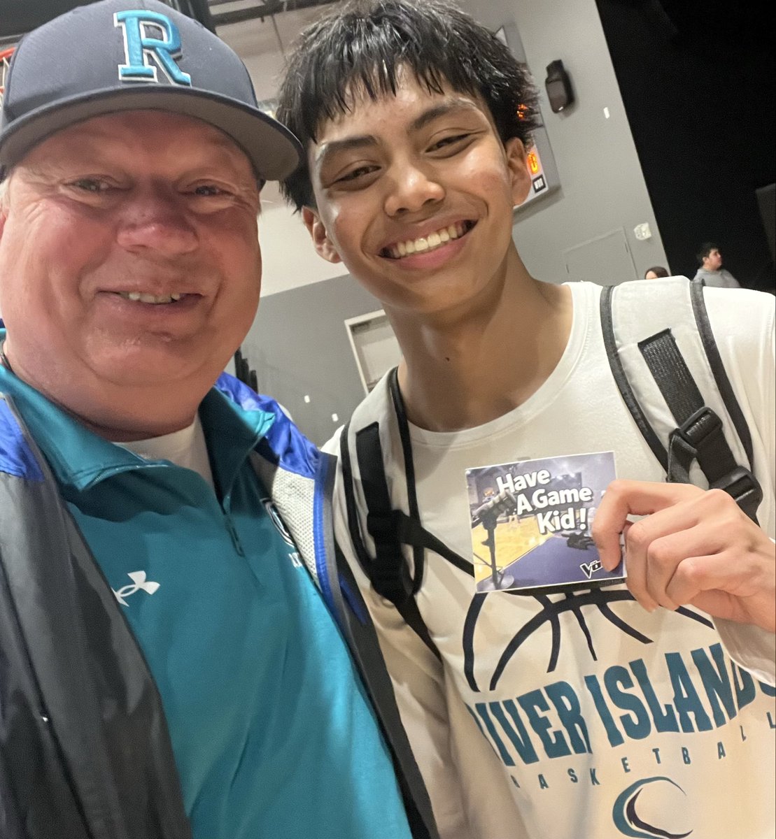 MarkRCondit's tweet photo. Friday Night #HAVEAGAMEKID athletes at River Islands tonight - John Engaling II (white shirt) scored 14 points to lead RI JV Boys to a 51-47 win over Sierra while Charles Mapanao (black hoodie) hit FIVE THREES to lead the RI Varsity to a 73-58 win over the visiting TWolves !!!!!! https://t.co/cKZUPNnQD0