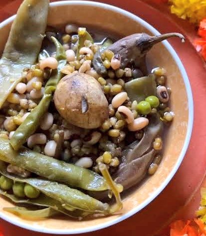 Gramergolpo's tweet photo. Gota Sheddho  is made on the day of Saraswati Puja in Bengal and eaten the next day that is Sheetal Shasti. Gota means whole and Sheddo means boiled.

People cook Gota Sheddho on the night of Basant Panchami or Saraswati Puja and let it sit overnight. The next day, they eat it cold on Shitol Shoshthi, the sixth day of the month. Bengali women honour Ma Shashthi, the goddess of fertility, by praying for their children’s health and happiness.On Shitol Shoshthi, families give the Shil Nora (the flat stone grinder) a break, and some even perform pujo for it. Sharing food is a significant part of this tradition. People pass around a bowl of Gota Sheddho among family, friends, and neighbours, strengthening bonds and fostering a sense of community.

It is made with 5 types of vegetables - small size Potato, Flat Beans, small brinjal, Green peas, spinach with stem and roots (shish palak) and whole mung dal or whole black lentils.

#Food #Tradition #culture #BengaliCuisine 

Pic from Internet.