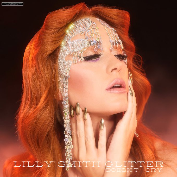 The Dollhouse has re-opened, and the most sparkling doll of them all is ready to play again. <a href="/theaussiepinup/">Lilly Smith</a> returns with her new single, #GlitterDoesntCry, available at digital and streaming outlets now! lilly-smith.lnk.to/glittercry