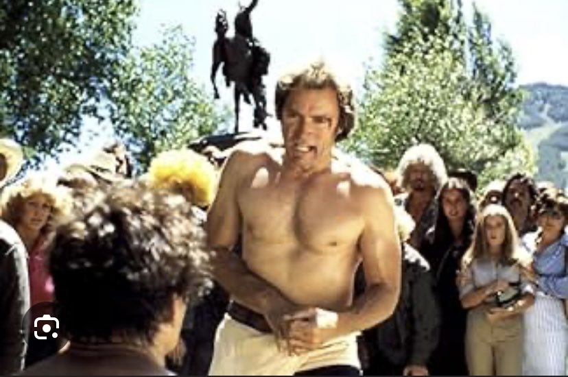 RayMiranda's tweet image. Both pics are taken in Jaskson Hole, WY. Both are in the heart of town with the same cool statue over the right shoulder. 
One guy is a strong, tough cowboy. The other guy is Clint Eastwood.