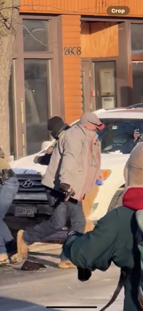 Botzy2k's tweet photo. @HollyBe28811612 @kerryowen1 @MeachamDr That’s the exact frame the first shot went off. The ice officer already had his gun. He was unarmed when he “drew” his gun? You’re the only retard here https://t.co/so9fnROHxk