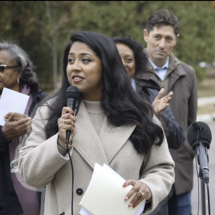 Meet Aurin Chowdhury, city council member of Ward 12, also spotted participating in the ICE Watch Signals group. You probably notice her on stage often giving words of encouragement and support while her handlers are watching.