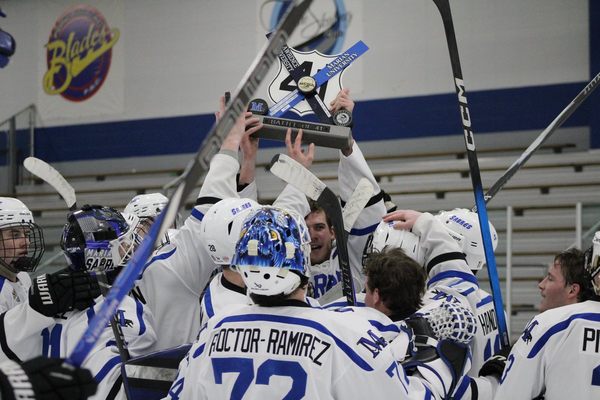 MU_Mens_Hockey's tweet photo. The trophy returns HOME https://t.co/VthlO3DLcd