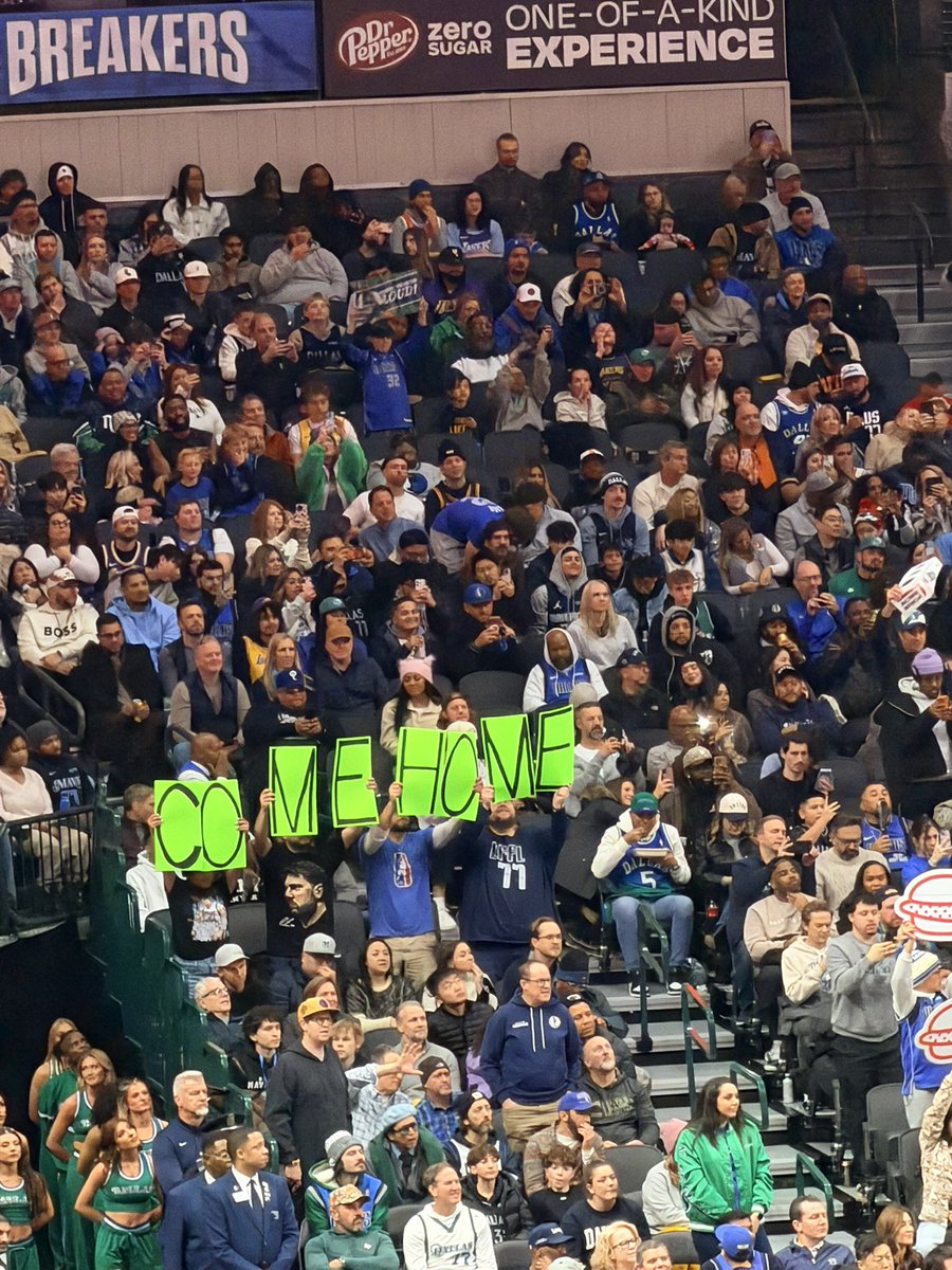 “COME HOME” behind the basket with Luka at the line 😭