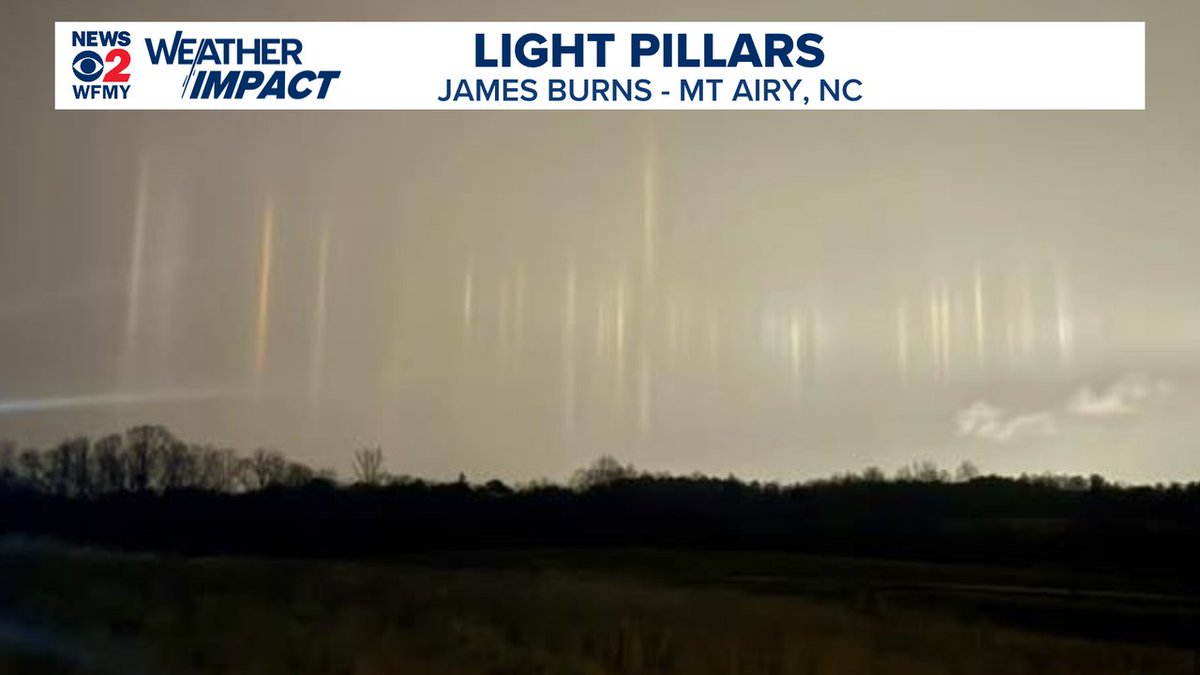 AMAZING! 
James Burns caught an awesome photo of some "light pillars" in Mt Airy this evening. 
These can happen when ice crystals are in the air. 
Sleet was falling at the time.