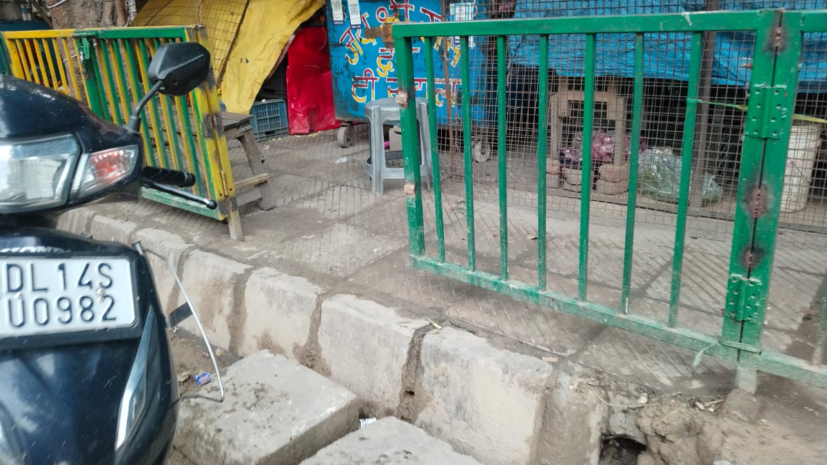 Steel Grill Installed by DDA on Footpath A2(41-80) Mayur Vihar Phase-3 Delhi -110096 in July 2025 has been broken and stolen by illegal street vendors who have made the encroachment on Footpath.