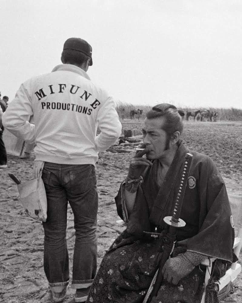 Toshiro Mifune having a smoke during the filming of “Red Sun” (1971).