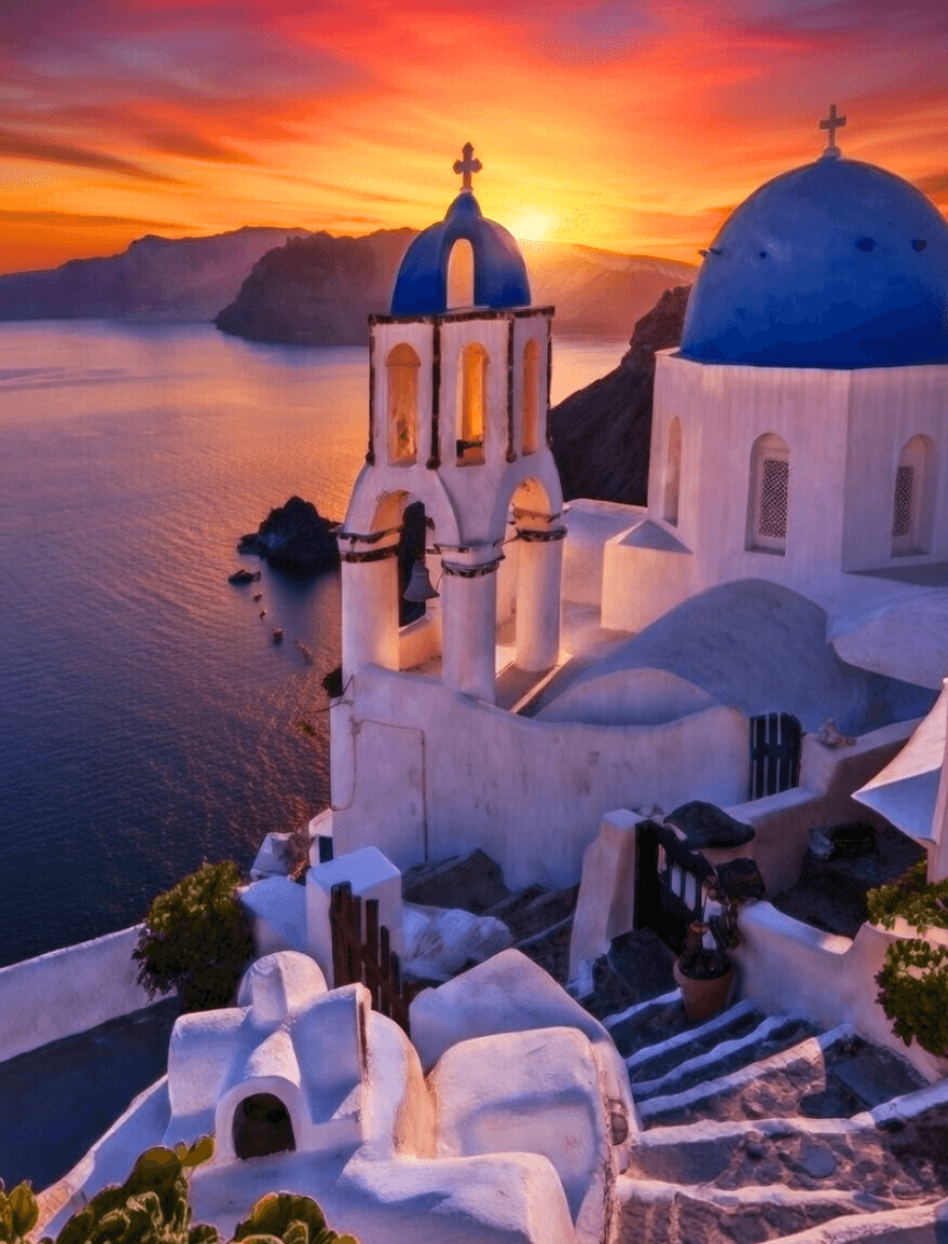 Blue domes dancing with Santorini's fiery farewell—timeless romance etched in the horizon. 🌅💙🇬🇷  
.
#Santorini #Greece #SunsetVibes
