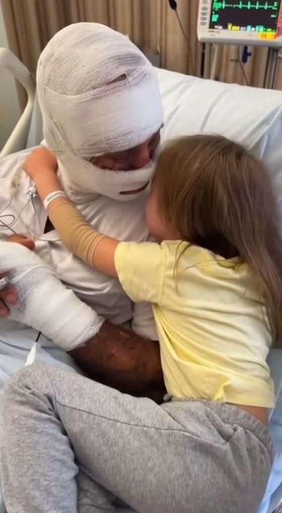 She walked away with only a small scratch. That's because the neighbor she's hugging in this hospital bed ran through a burning house just to get to her door.

David wasn't a firefighter; he was just the guy who lived next door to 6-year-old Lily and her family.
He was watching