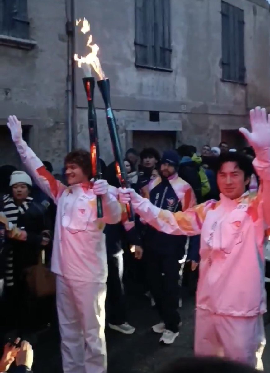 ‘Heated Rivalry’ stars Connor Storrie and Hudson Williams carrying the Olympic torch together today in Italy.