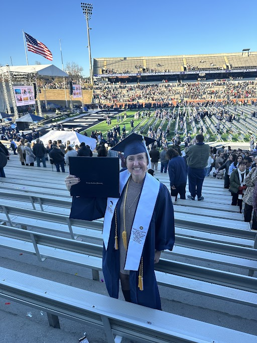 GeorgiaSouthern's tweet photo. At 47 years old, Katie Logsdon crossed the stage in December 2025 earning the degree she had started nearly three decades ago. With family by her side, she proves that determination belongs in all aspects of life.

Her story 🔗  https://t.co/BenBsFqIDi 

#GSGrad25 https://t.co/X0BDNXPwEv