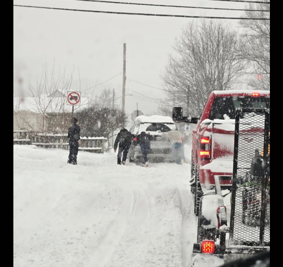 This photo was sent to me from a resident if the city of Pittsburgh district 2. This photo is not a public works crews this is regular city residents helping a driver. 

Public works is doing the best they can! It is becoming difficult for their equipment.
Everyone please stay