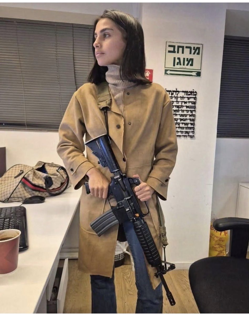 Israeli Channel 14 correspondent poses with a hefty lethal weapon inside a picture taken by her colleagues while inside the newsroom’s offices.

This is why Israelis think Palestinian journalists can be armed, because they assume the world is as demented and depraved as they are.