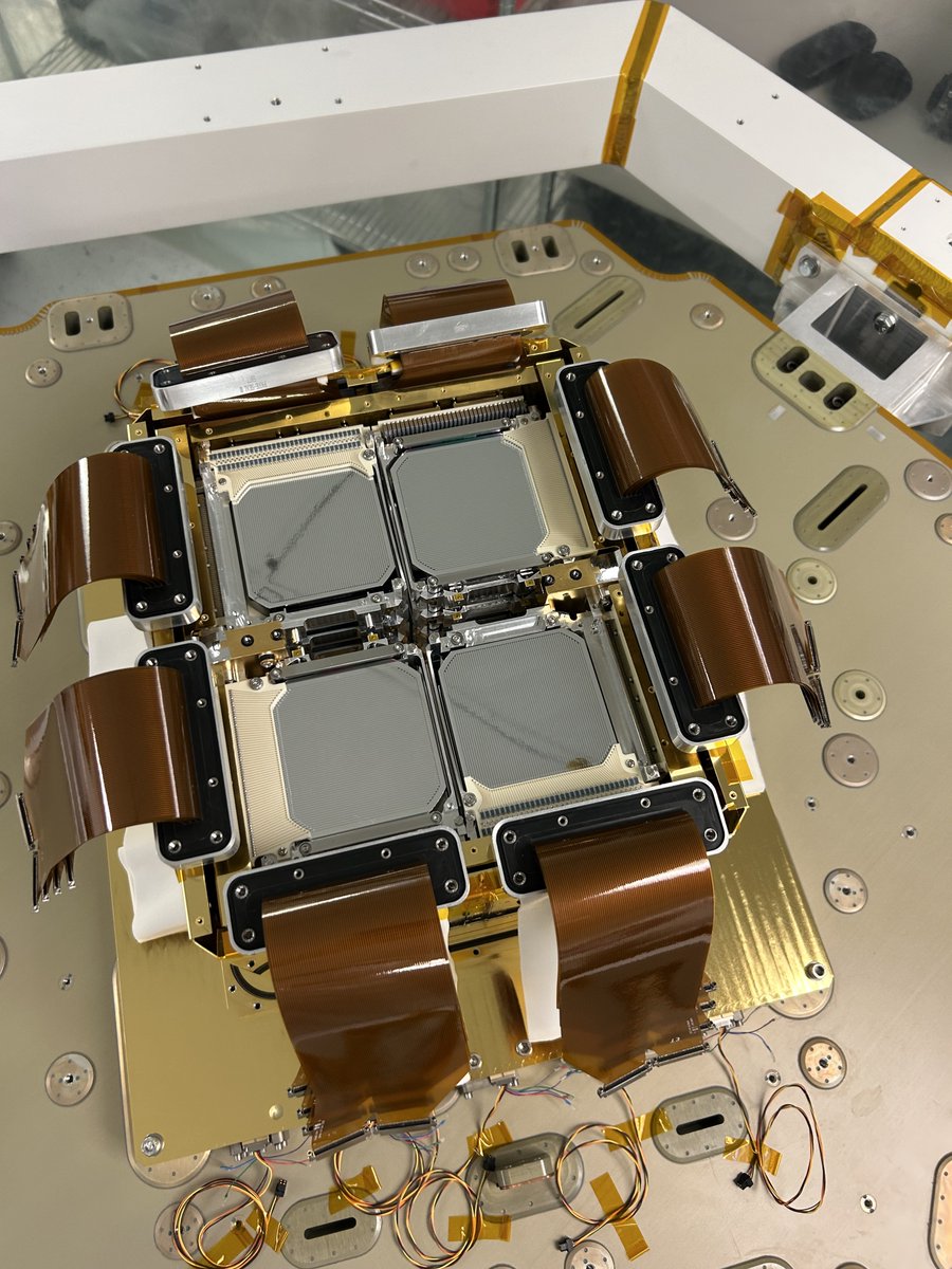 COSITelescope's tweet photo. Germanium detectors happily installed at the top of the COSI payload.  Once they are enclosed in the cryostat shell, a vacuum pump is used to evacuate the volume, and the detectors are cooled.  After applying high voltage, they will be able to detect gamma rays! https://t.co/EYJNNn06wG