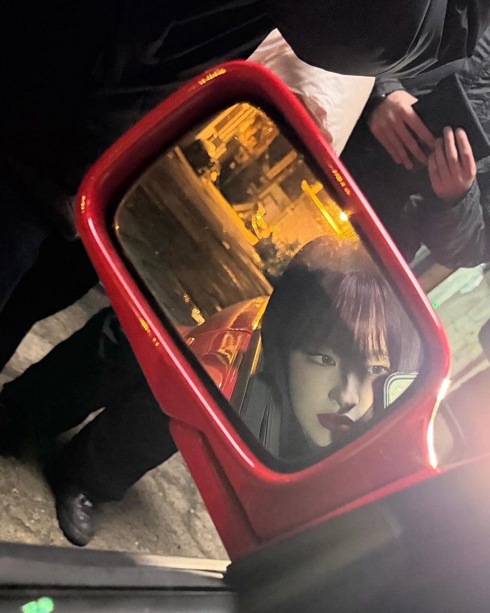 Lijzzie's tweet photo. framed by crimson reflections and city lights, she meets her own gaze in the quiet pause of the night. Red lips, sharp eyes, and a stillness that feels deliberate, like a secret only the mirror gets to keep. Between shadow and glow, she exists unapologetically, calm, &amp; dangerous. https://t.co/hGJZcofuLY