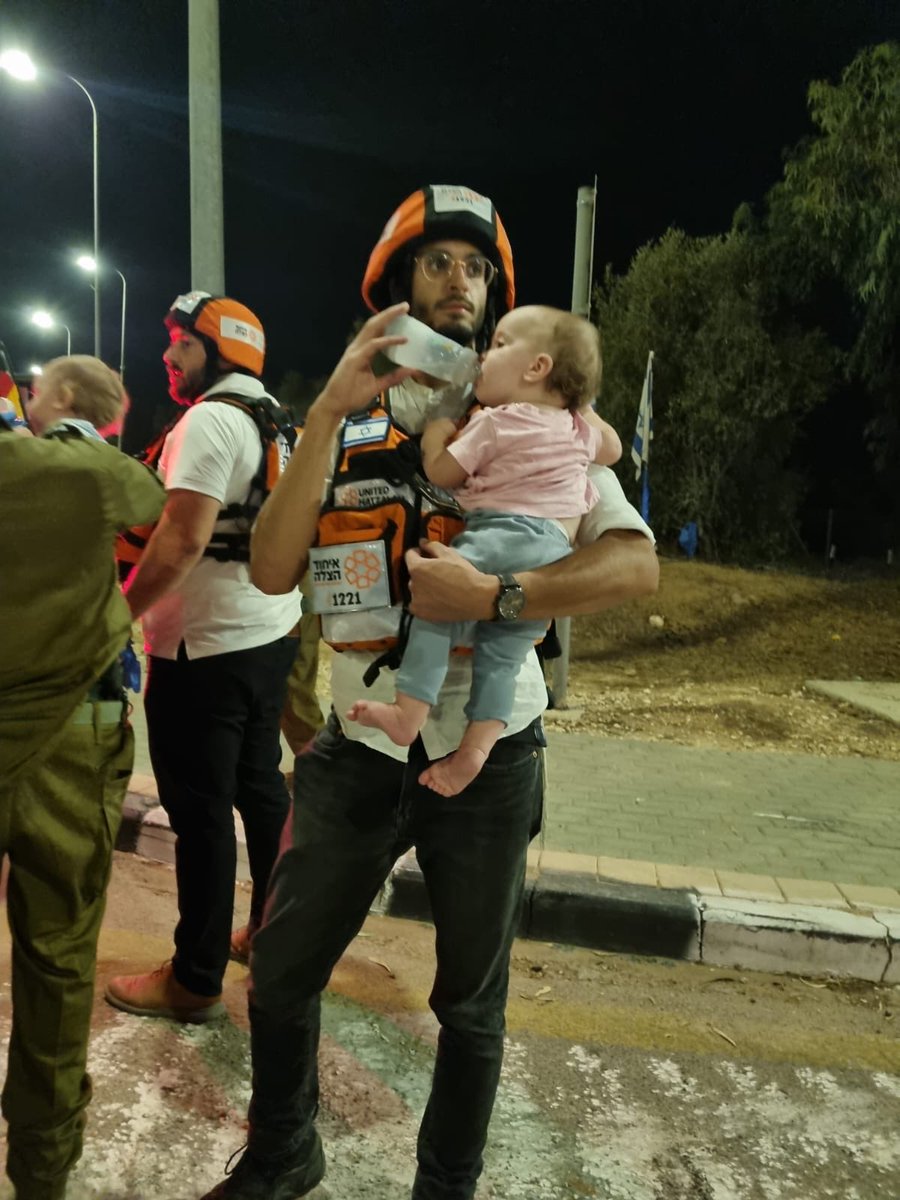 RabbiPoupko's tweet image. I still cry every time I see this image of an Israeli medic holding a baby orphan on the night of October 7th, 2023. 

We will never forget what Gaza did to our people.